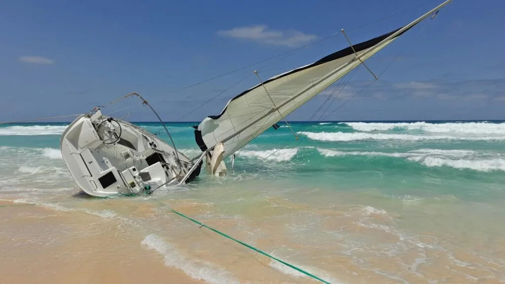 This image shows what we try to avoid by knowing our sailboats ratios: capsizing