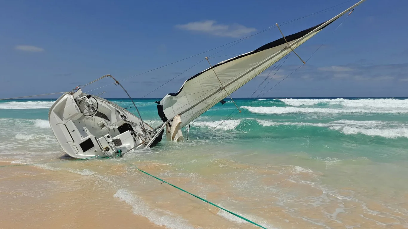 This image shows what we try to avoid by knowing our sailboats ratios: capsizing